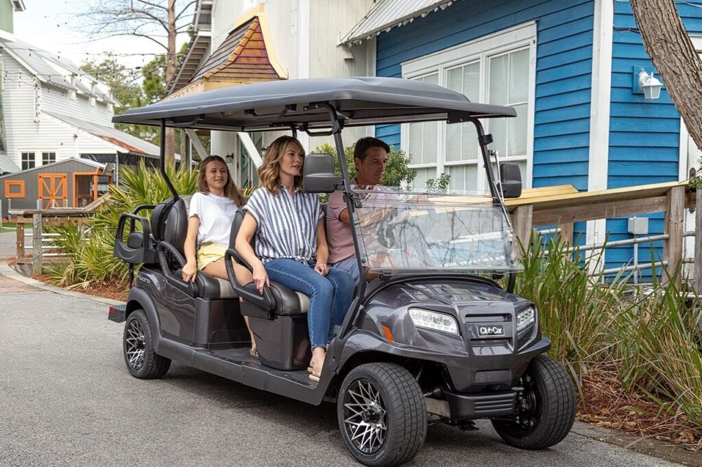 family in a golf car
